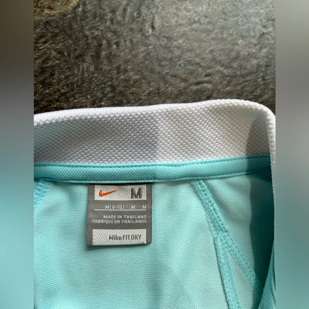 Women’s Nike Sphere fit dry pull over V neck short sleeve. Light blue. Medium